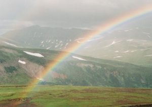 rainbow-over-mountain-valley
