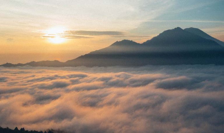 mountain-poking-through-clouds