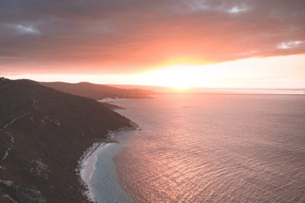 rippling sea washing mountainous shore